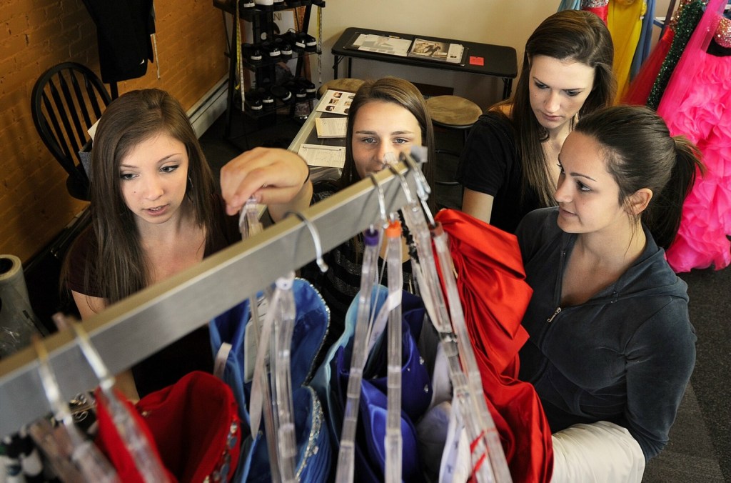 Breanna Battista, Shelby Peterson, Abby Chadburn and Brianna Silva are all headed to the Scarborough High prom. They each tried on several styles of dresses at Simply You Boutique. Gabe Souza/Staff Photographer