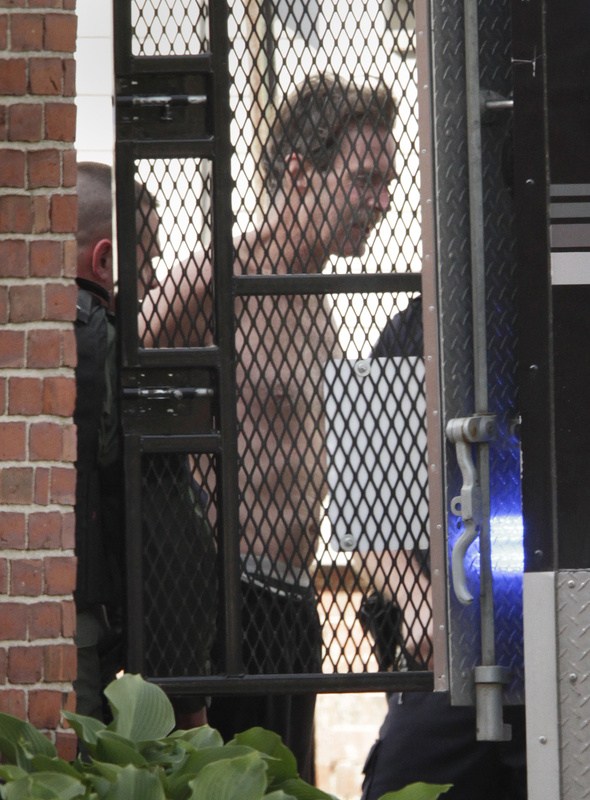Police arrest shooting suspect Brian Kelley, who emerged from 19 Cedar St. in Portland after tear gas was shot into the building’s second-story windows.
