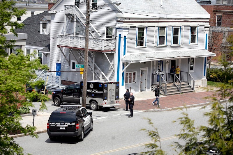 The corner of Cumberland Avenue and Cedar Street is blocked after a shooting that started a standoff Saturday at a Cedar Street apartment building.