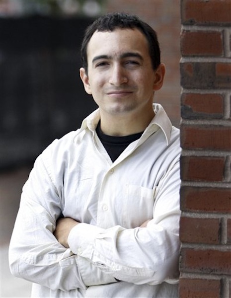 In this July 30, 2009 file photo, Joel Tenenbaum, from Providence, R.I., poses outside federal court in Boston, after taking the stand in his defense in his copyright-infringement trial. On Monday, May 21, 2012, the U.S. Supreme Court refused to hear an appeal from Tenenbaum, who was successfully sued by the Recording Industry Association of America for illegally sharing music on peer-to-peer networks. In 2009, a jury ordered Tenenbaum to pay $675,000, or $22,500 for each song he illegally downloaded and shared.(AP Photo/Bizuayehu Tesfaye, File)