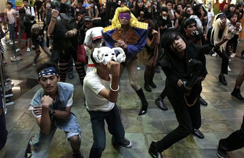 Fans of U.S. pop star Lady Gaga perform a flash mob at a shopping mall in Jakarta, Indonesia, Sunday, May 27, 2012. Lady Gaga canceled her sold-out show in Indonesia after Islamist hard-liners threatened violence, claiming her sexy clothes and provocative dance moves would corrupt the youth. (AP Photo/Dita Alangkara)