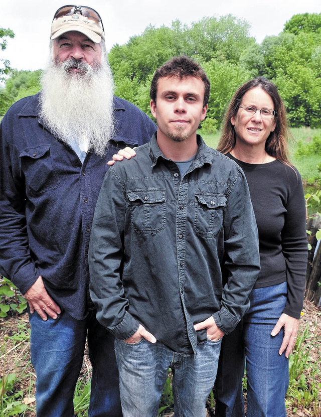 Relatives of Capt. John "Jay" R. Brainard III, who was killed in Afghanistan on Monday, speak about Brainard at his parents' home in Newport on Wednesday. From left are his Uncle Don White, his brother Benjamin Hawthorne and his Aunt Nancy White.
