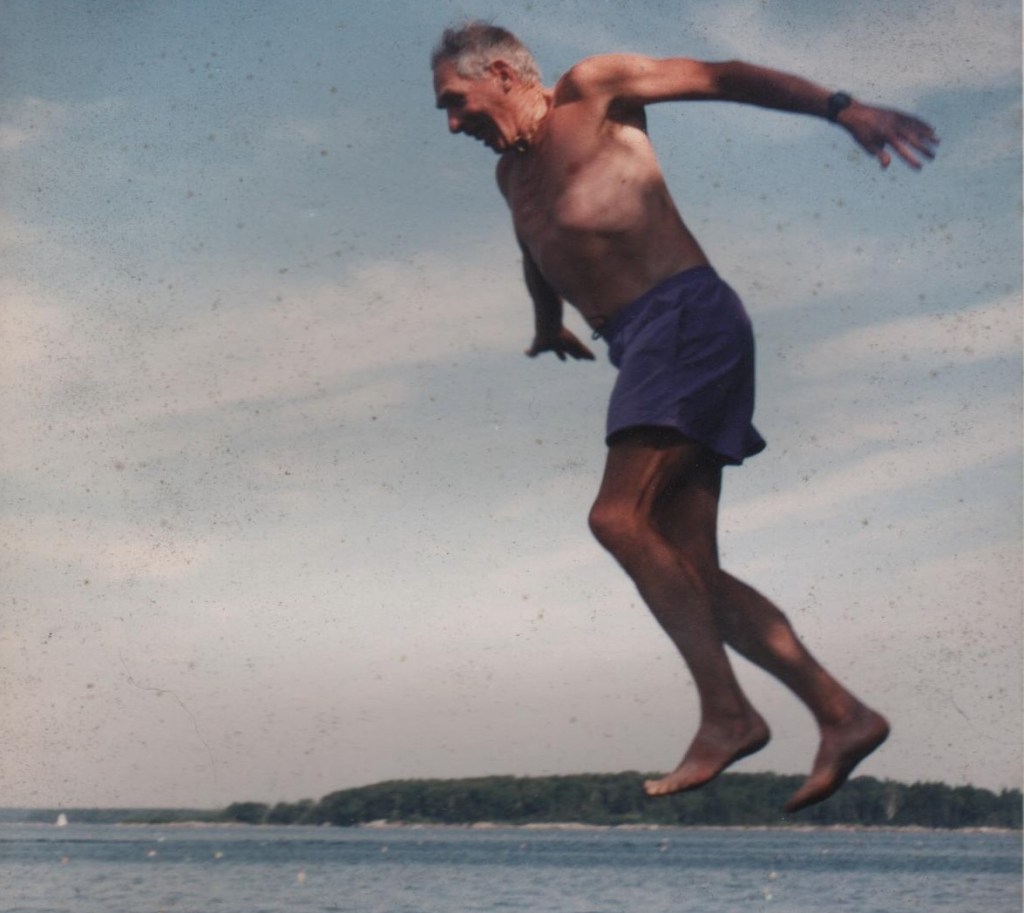 Robert ‘Hap’ Hazzard jumps from rocks near his camp on Moshier Island in Casco Bay.
