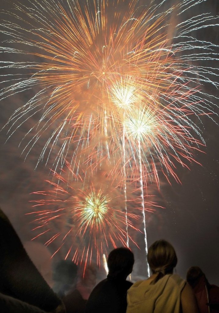 Spectators watch July Fourth fireworks last year on the Eastern Prom in Portland.