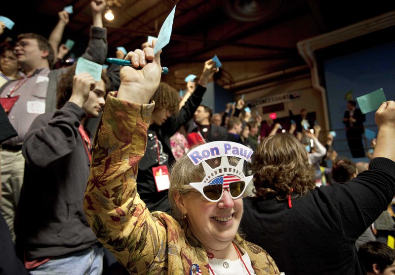 Linda Silvia of China, a Kennebec County delegate, votes for Ron Morrell to be convention secretary at the Maine Republican Convention in Augusta on Saturday. A Paul backer also was elected convention chairman.