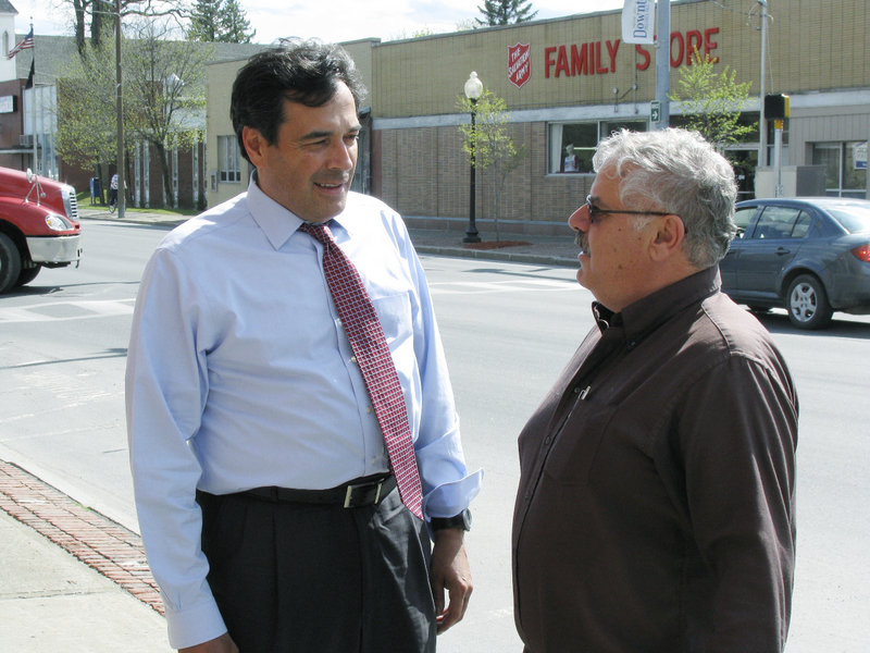 GOP Senate candidate Rick Bennett, left, talks with Rick Castonguay of Big Bear Real Estate on Main Street in Presque Isle on Friday.