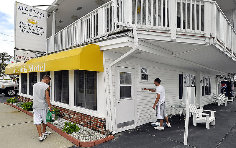 Joey Mokarzel helps get the Atlantis Motel, part of Atlantis on the Beach in Old Orchard Beach, ready for the tourist season Thursday.