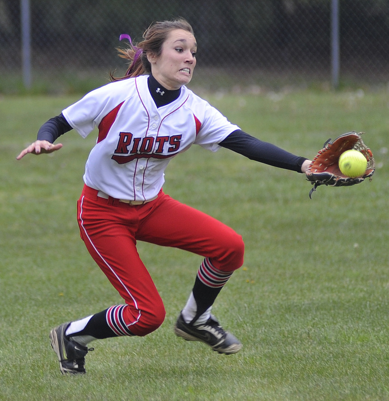 Kelsey Morton of South Portland takes control in the outfield and darts in to make a running catch against Massabesic.