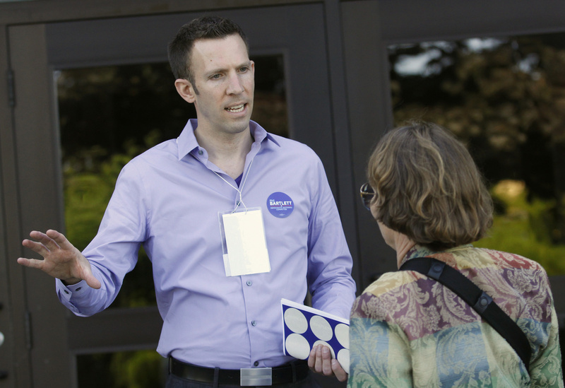 State Sen. Phil Bartlett of Gorham, who is running for Democratic National Committee, talks with Susan Schnur of Islesboro before the convention on Friday.