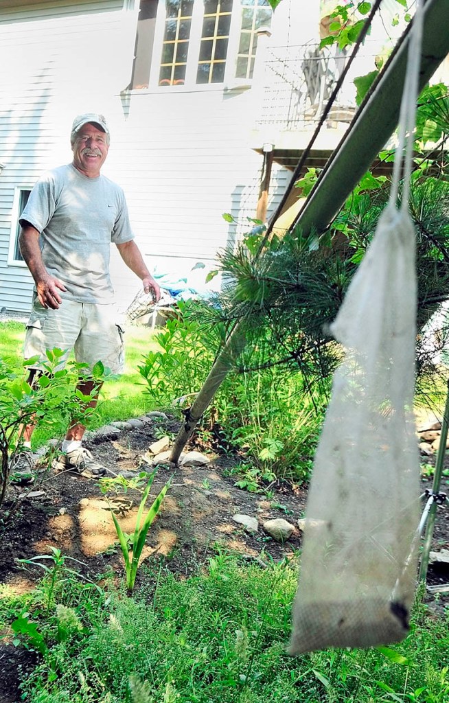 Jim Remley talks about the bear that recently knocked down a flag pole in his Winthrop backyard. Remley used the pole to raise and lower bird feeders from which the bear was apparently trying to eat..