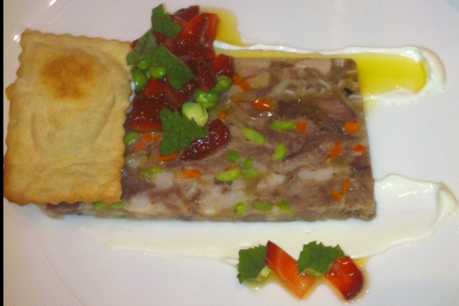 At East Ender, Mitchell Gerow is making a hogs head cheese with peas and strawberries.