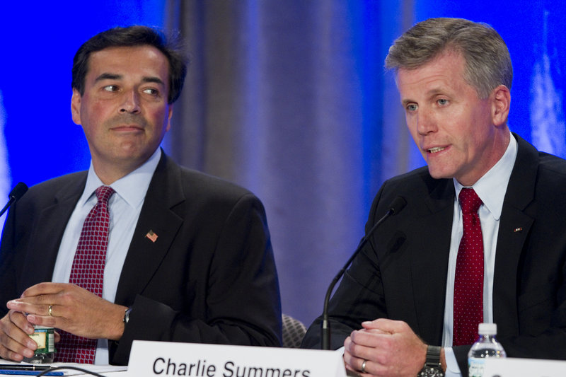 U.S. Senate hopeful Rick Bennett, left, listens to rival Charlie Summers during the Republican debate Saturday.