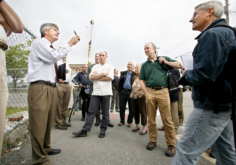 Bill Needelman, a senior planner for Portland, talks about building heights during a public tour of the India Street corridor in 2014. Earlier this decade, the city led a multi-year public process to craft new zoning rules for the neighborhood, laying the groundwork for new housing and businesses on the neighborhood's vacant lots. 