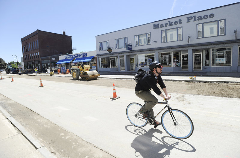 Michael Drinan, the owner of the Market Place building, above, and other business owners collected 600 signatures in favor of maintaining angled parking on Ocean Street, to no avail.