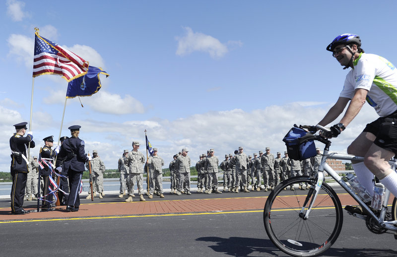 A contingent from the Army National Guard gathers for opening ceremonies at the bridge.