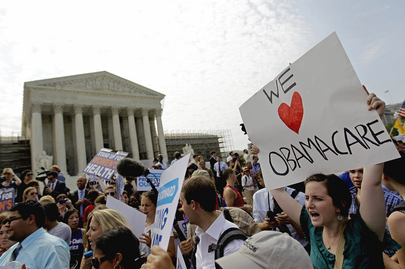 Supporters of President Obama’s health care law celebrate outside the Supreme Court in Washington after Thursday’s ruling. It’s “a victory for people all over this country whose lives will be more secure,” the president said.