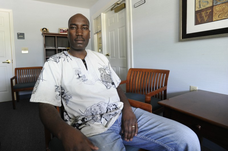 Georges Budagu, a new U.S. citizen from the Democratic Republic of Congo, at his office in Gorham.