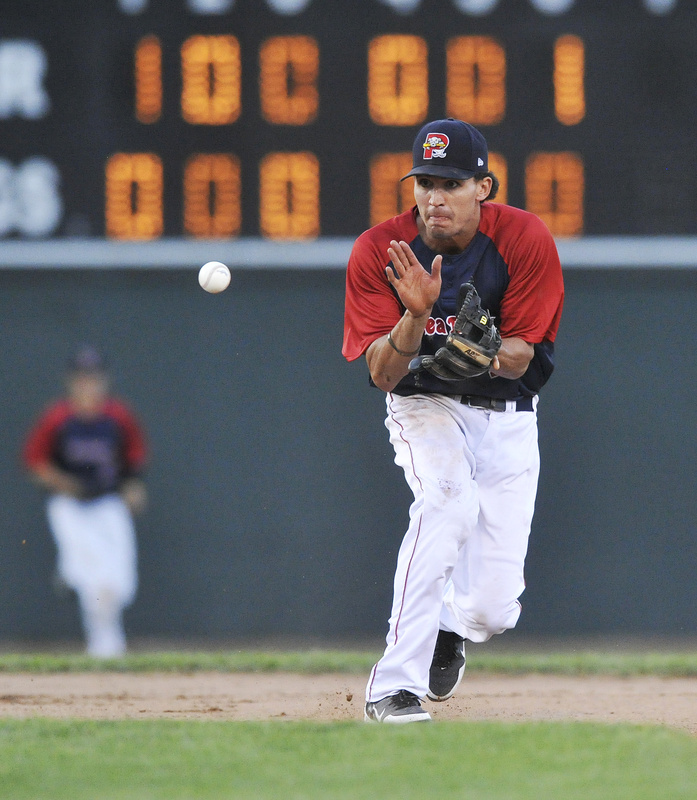 Derrik Gibson of the Portland Sea Dogs follows a grounder into his glove in the seventh inning. Portland and Trenton play two games today.