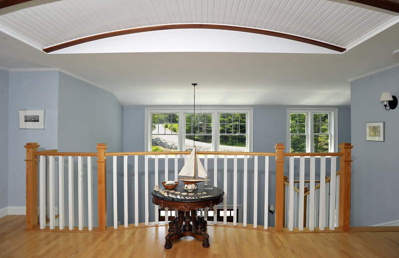 The pleasant upstairs foyer boasts curves and color.