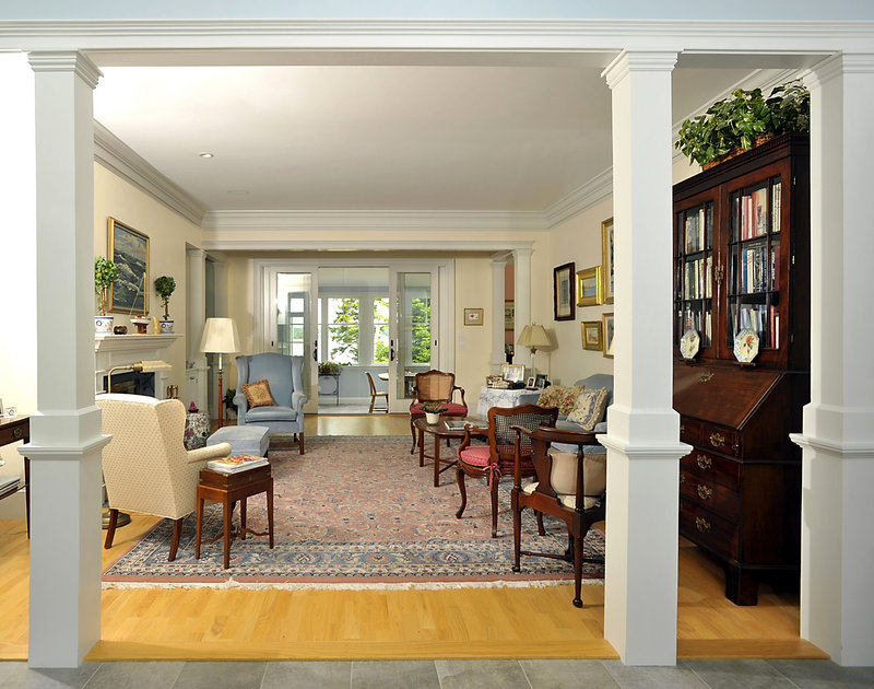 Columns frame the living room, home to some of the furniture that moved with the couple from Boston.