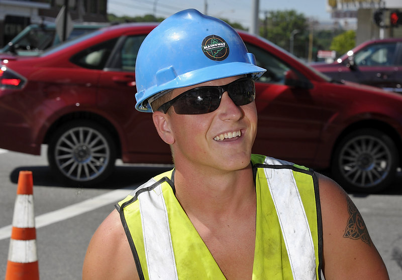 Alex Hebert, 21, of Biddeford is laying brick this summer before the beginning of his senior year at UNE. He said the sluggish economy hasn’t hit him as hard as it has his parents.