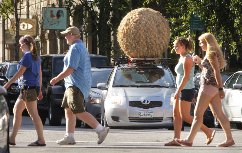 Artist Michael Shaughnessy, waiting at an intersection in Portland, plans on documenting his cross-country trip in video.