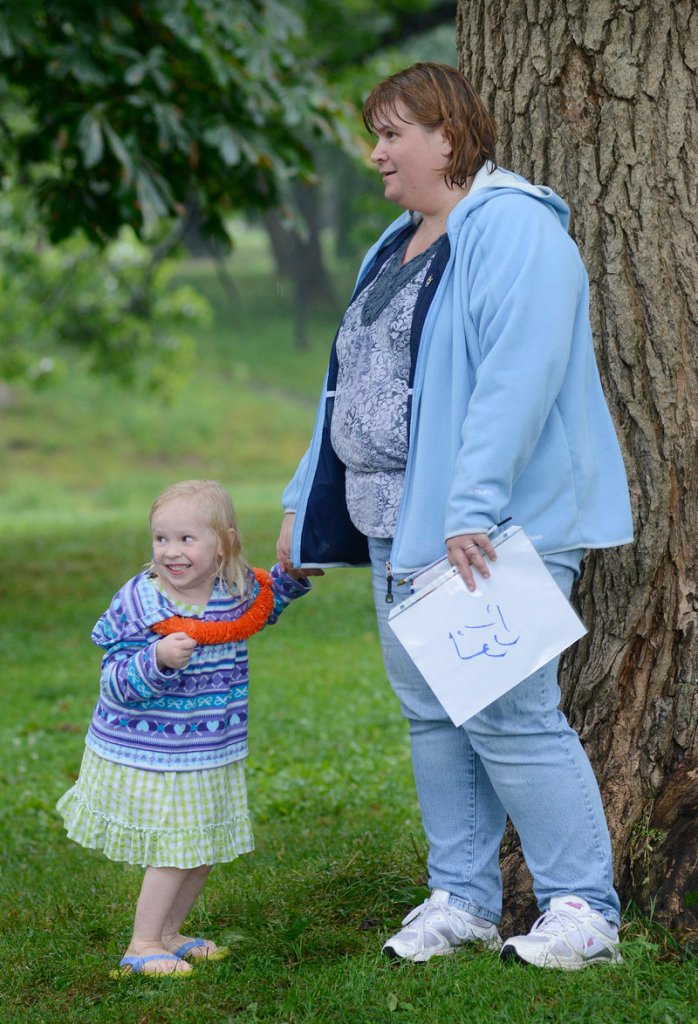 Laura Huff, 4, dances to the music as her mother, Susan Huff of Dayton, watches a performances at the festival.