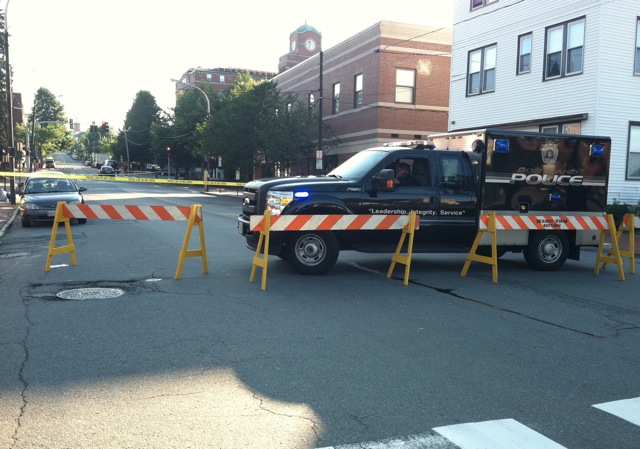 Police closed a section of Congress Street this morning while they investigated the scene of this morning's shooting. This photo is shot from the intersection of Congress and Locust, looking up Munjoy Hill.