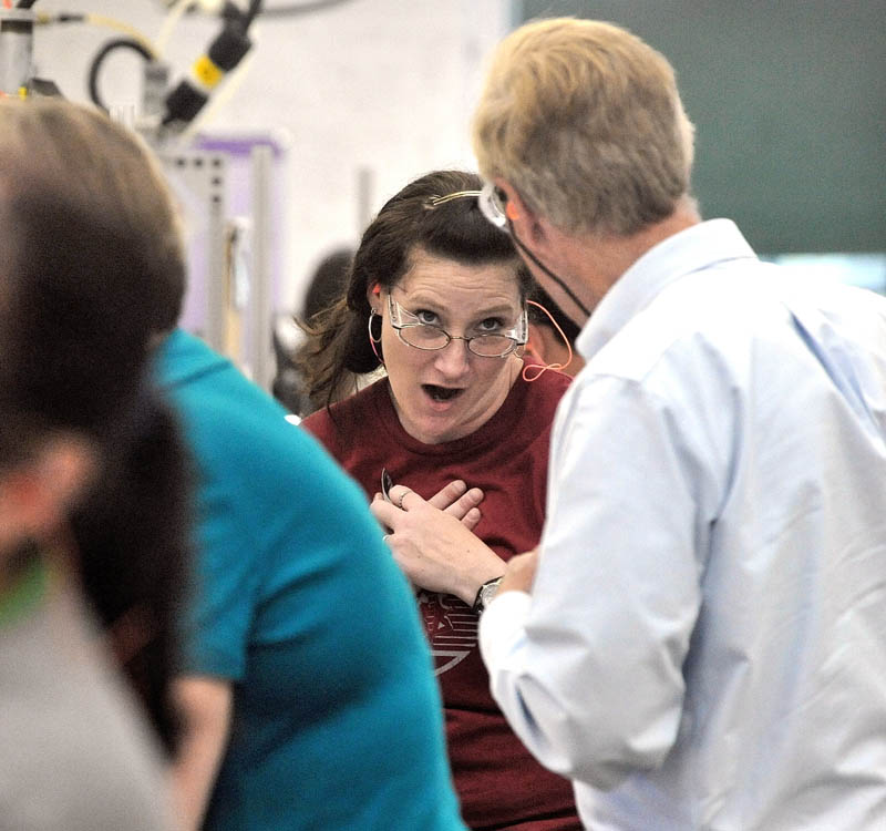 Vanessa Bolstridge, a seven-year veteran employee at New Balance, reacts to Senate candidate and former governor Angus King, right, during a campaign tour of the Skowhegan factory Tuesday.