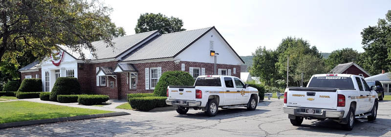 Somerset County Sheriff's vehicles occupy the parking lot at Camden National Bank in Bingham after a robbery was reported Thursday.