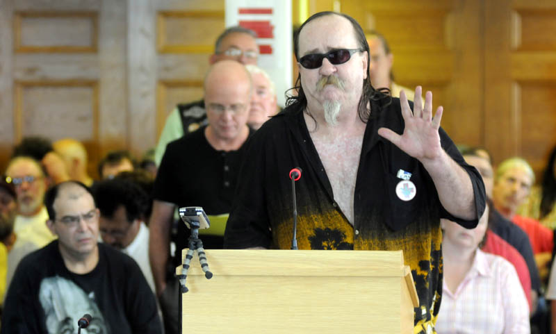 Chris Kenoyer, of Cumberland County, addresses a public hearing Monday in Augusta about the proposed new rules for Maine's medical marijuana program.