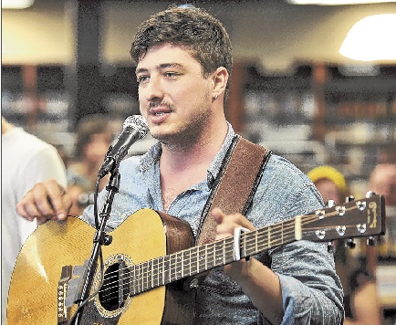 Lead singer Marcus Mumford chats with his audience at Bull Moose Music in Scarborough Friday.