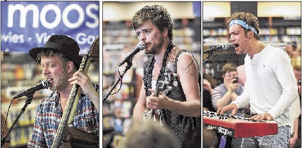 Band members Ted Dwane, Winston Marshall and Ben Lovett, perform. The band will headline Saturday’s festival.