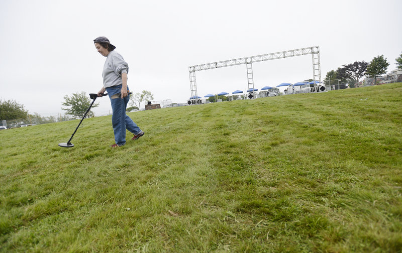 Carol Whitmore of Portland said if she found anything of value with her metal detector, she would turn it in to city workers. She was sweeping the hill because “it’s just my fun, a hobby.”