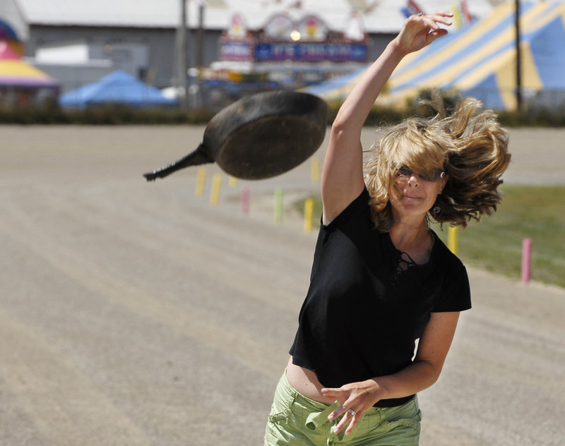 A contestant lets it rip in the Frying Pan Toss at the Topsham Fair.