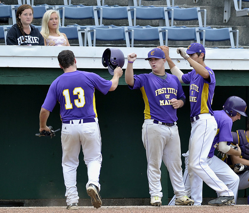 Peter Potthoff of First Title receives congratulations after scoring in the tournament game at Old Orchard Beach.