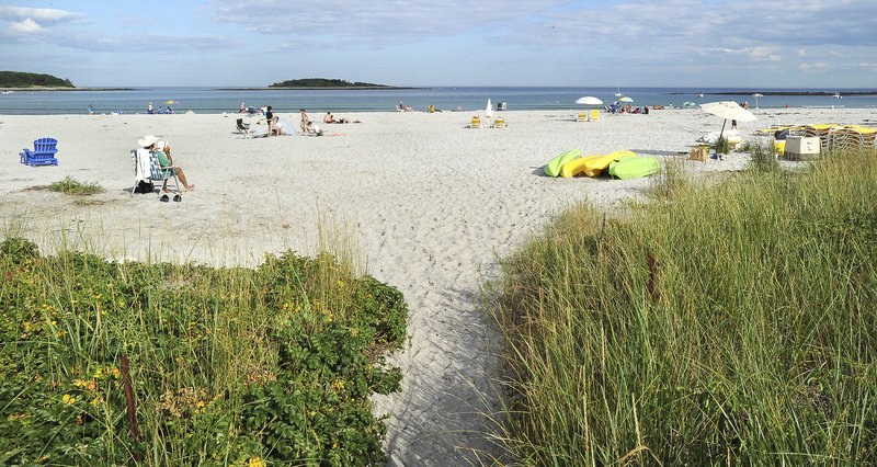 A path leads to a section of public beach at Goose Rocks in Kennebunkport. A proposed ordinance would establish a reserved area that extends 25 feet from any participating beachfront property’s sea wall toward the water.