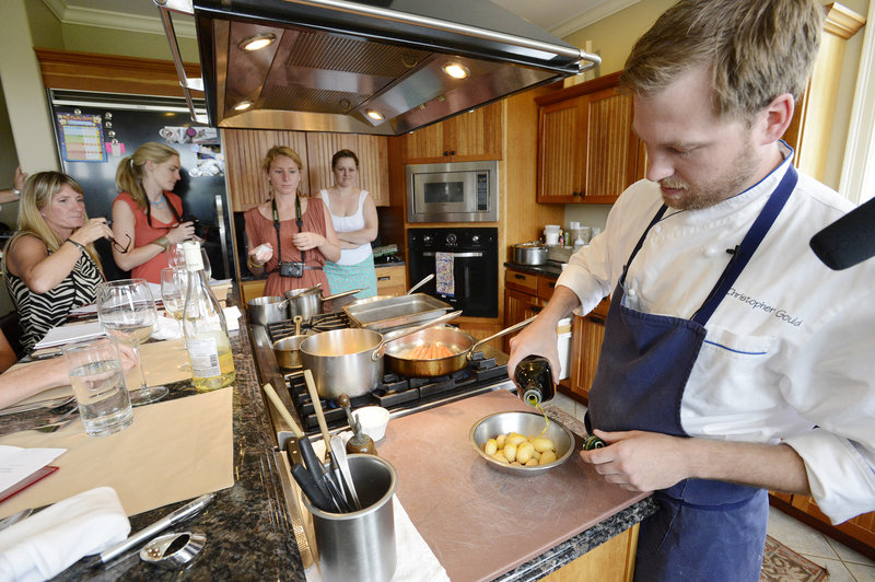 Chef and Maine native Chris Gould prepares his dish during the Shucks Maine Lobster Chef “World Series” on Wednesday at the home of a fellow competitor, chef Steve Corry of Scarborough. Gould, who recently worked at Uni Sashimi Bar in Boston, beat out Corry and chefs from Germany and Hong Kong to win the coveted “Golden Buoy” trophy.