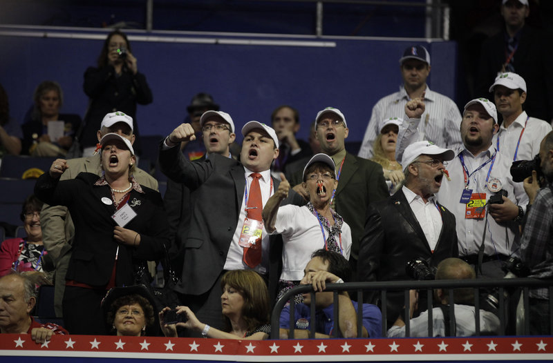 Ron Paul supporters from Maine protest Tuesday to call attention to what they say was unfair treatment of pro-Paul delegates and alternates who lost their seats to Mitt Romney supporters when it was ruled they were improperly elected.
