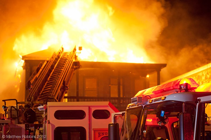 Firefighters on the scene of a fire that destroyed a two-story building Wednesday at 554 Main St. in South Portland.