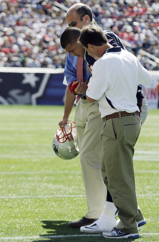 New England Patriots tight end Aaron Hernandez is helped from the field in the first quarter of an NFL football game against the Arizona Cardinals, Sunday, Sept. 16, 2012, in Foxborough, Mass. (AP Photo/Elise Amendola) NFLACTION12;