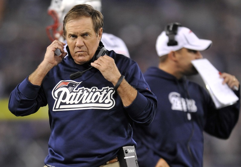 New England Patriots head coach Bill Belichick, left, looks on during the first half of an NFL football game against the Baltimore Ravens in Baltimore, Sunday, Sept. 23, 2012. (AP Photo/Gail Burton) NFLACTION12;