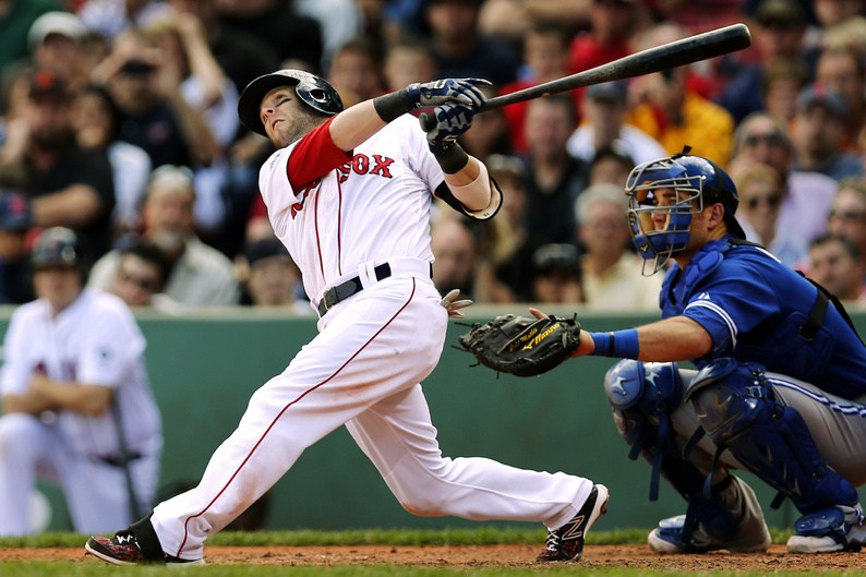 Dustin Pedroia follows through on his home run against the Toronto Blue Jays in the sixth inning on Sunday. Toronto won, 4-3.