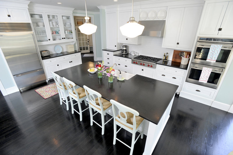 The floor in Laughlin’s kitchen is oak painted black.