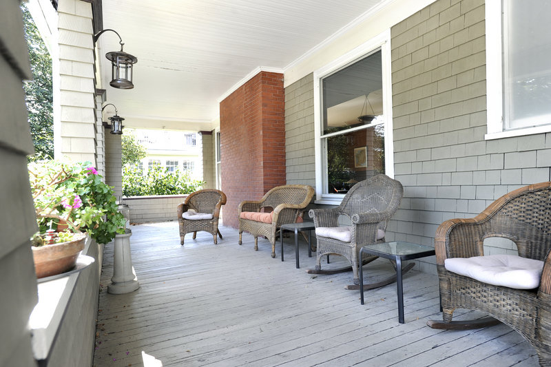 The front porch of the 1914 Arts & Crafts house near Back Cove in Portland is 44 feet long, 10 feet wide, and supported by stately columns.