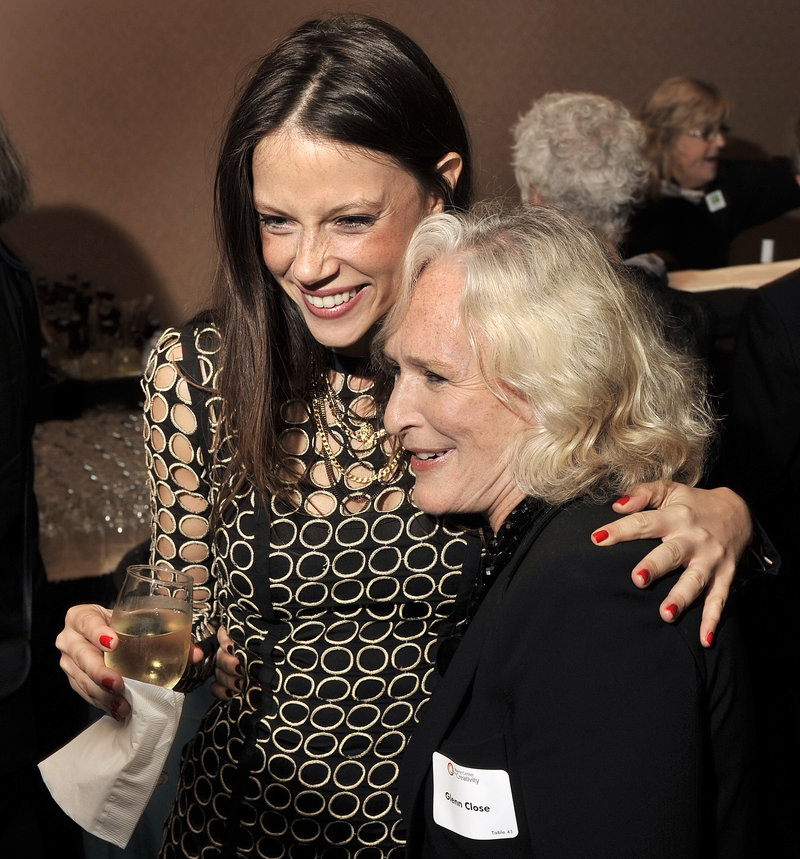 Actress Glenn Close shares a hug with model/actress Hani Avital at the cocktail reception prior to Maine Creative Industries Award Gala on Thursday, Sept. 13, 2012 at the Holiday Inn By the Bay in Portland.