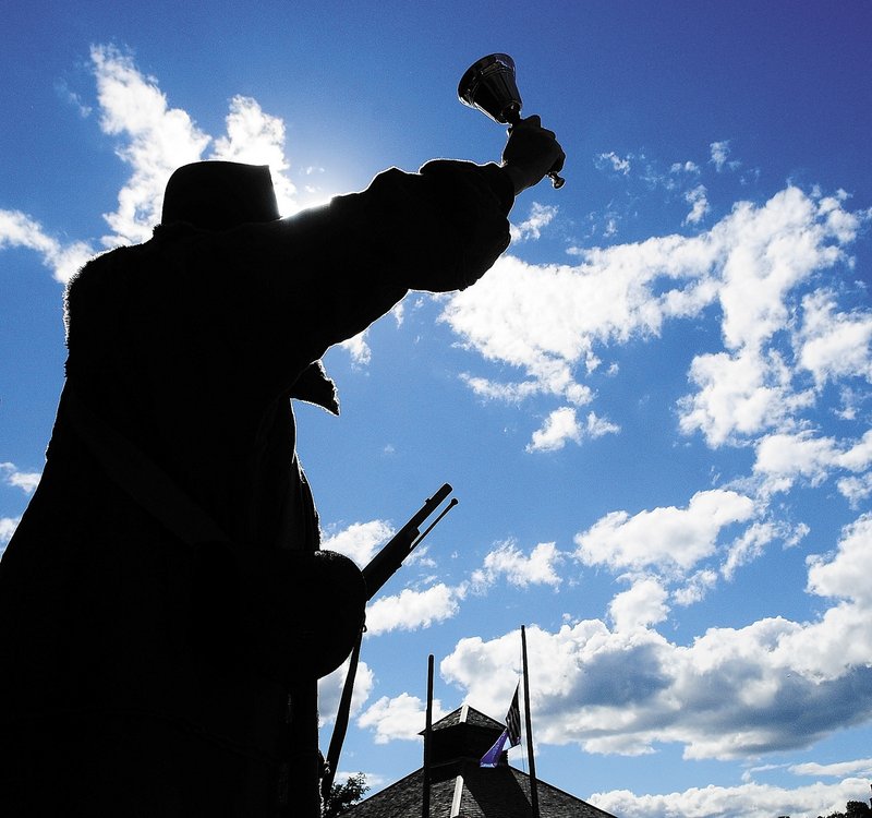 Town crier Pete Morrissey rings a bell to make an announcement at Old Fort Western in Augusta on Saturday as part of the 225th anniversary celebration of the U.S. Constitution.