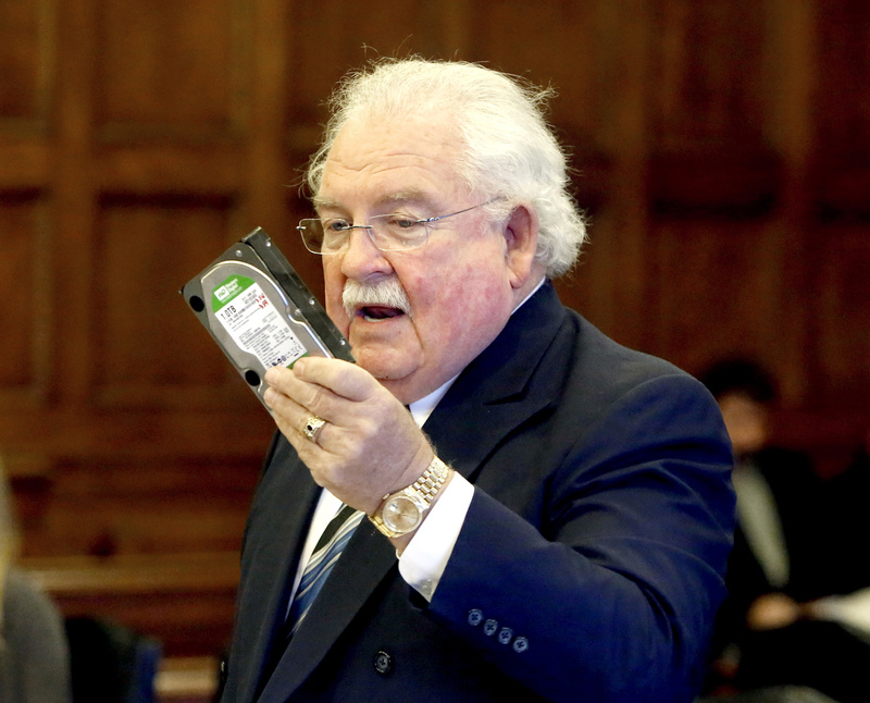 Daniel Lilley, attorney for Mark Strong Sr., holds a hard drive that he received as part of the discovery process in Tuesday’s proceedings. He estimated that he has only a quarter of the data in the alleged prostitution case that prosecutors have.