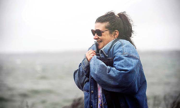 Hilda Anderson of Springvale had enough of Hurricane Sandy and headed back to her car after watching the storm crash onto East End Beach Monday, October 29, 2012.