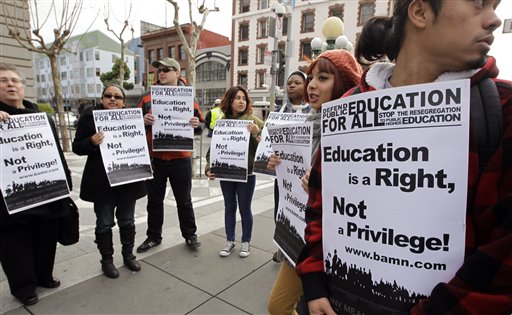 In this Feb. 13, 2012, photo, demonstrators protest outside of the U.S. 9th Circuit Court of Appeals after a panel heard oral arguments in San Francisco in a lawsuit seeking to overturn Proposition 209, which barred racial, ethnic or gender preferences in public education, employment and contracting. As the Supreme Court revisits the use of race in college admissions in October 2012, critics of affirmative action are hopeful the justices are poised to roll back the practice. A new report out Wednesday, Oct. 3, 2012 offers a big reason for their optimism: evidence the nine states where leading public universities don't use affirmative action have succeeded in bringing diversity to their campuses through race-neutral means. (AP Photo/Paul Sakuma, File)